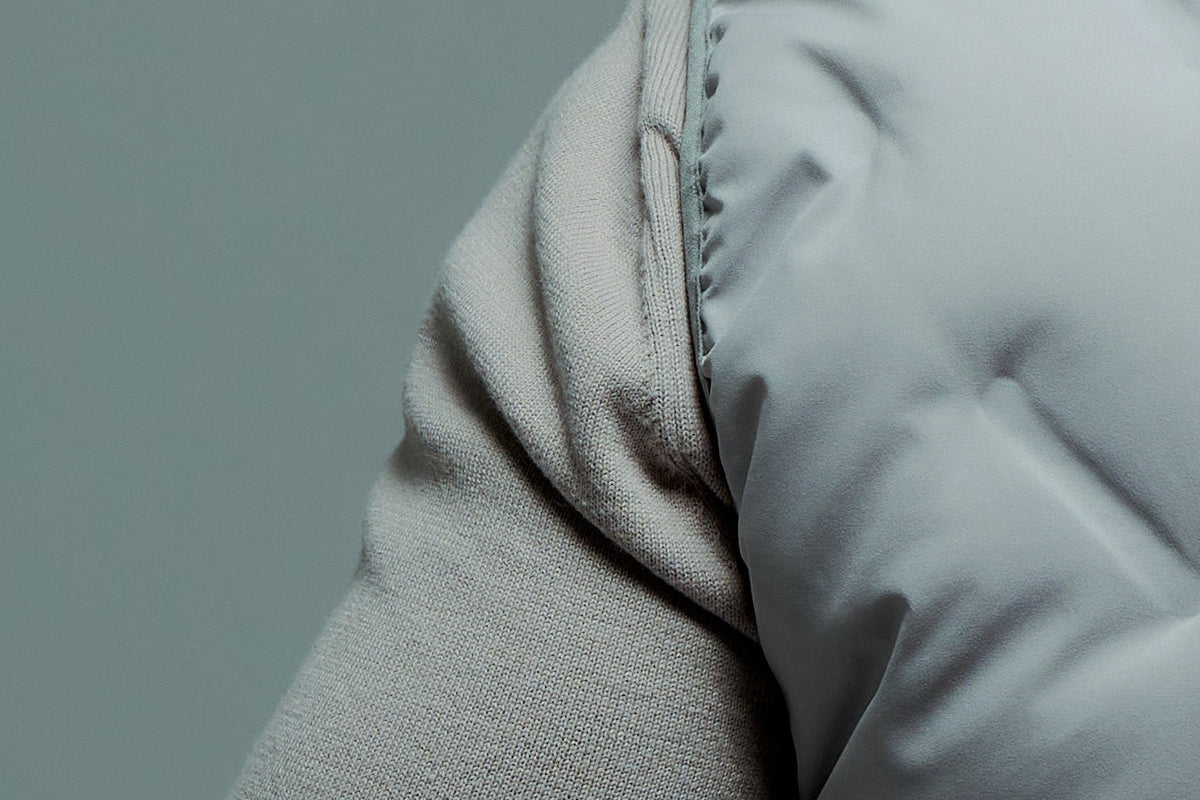 ARIO Gilet Vest — knit sleeve at the shoulder seam